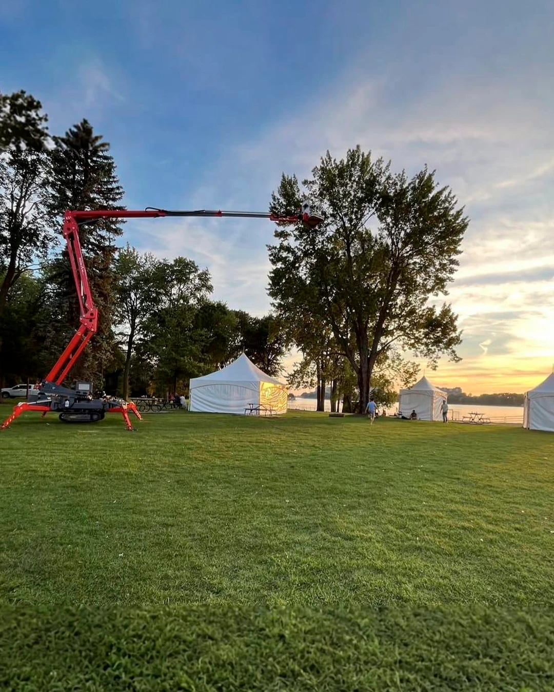 Sato spider lift set up for tree work at a lakeside park